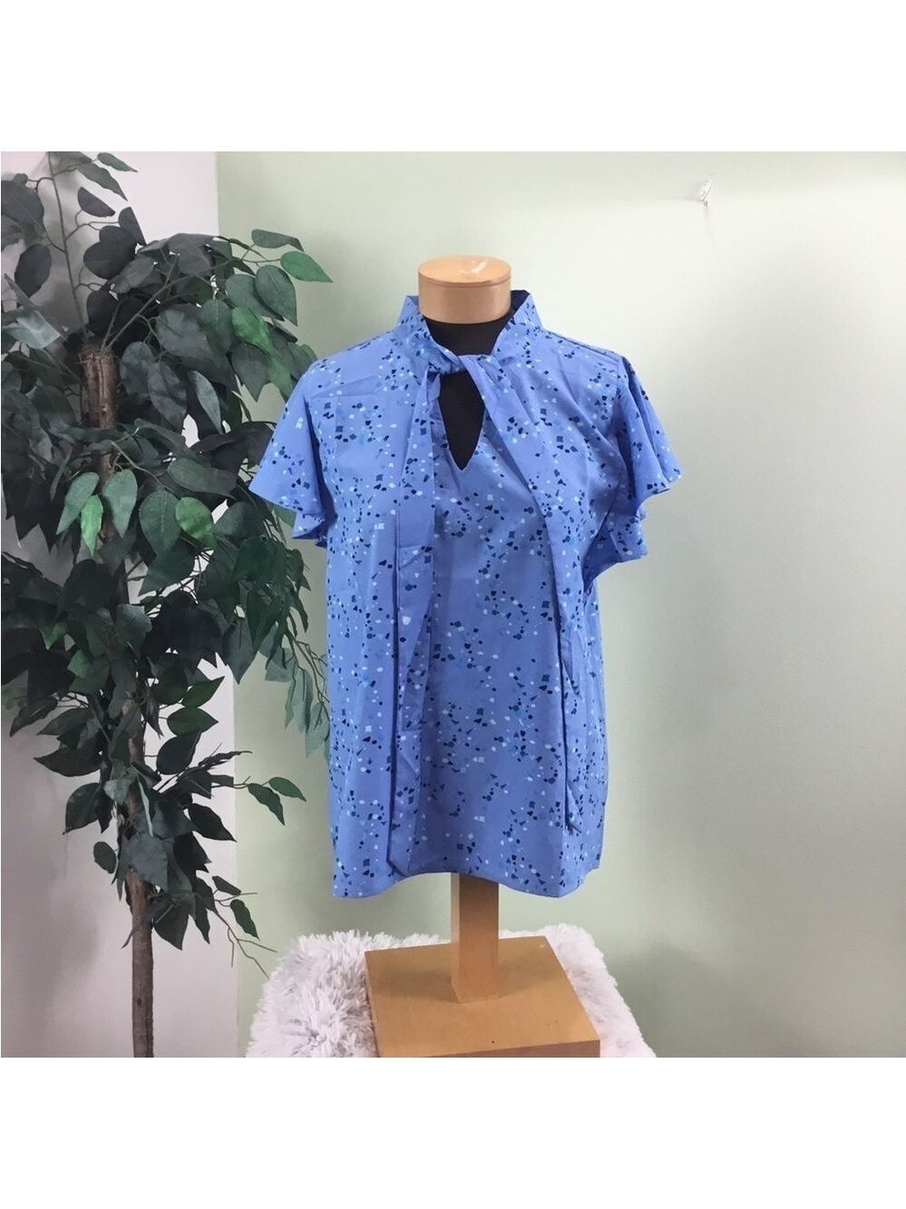 Tre’s Jolie medium shade of blue with a dash of green shorts sleeve blou…